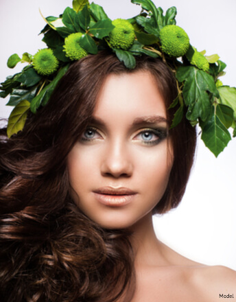 Woman with green leaves on her head