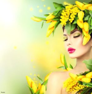 Relaxed woman surrounded by yellow flowers