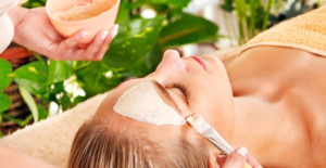 Woman receiving a facial treatment at a spa