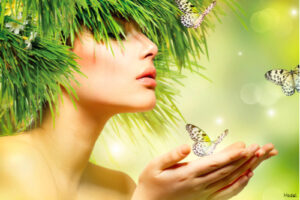 Woman wearing pieces of fir tree on her head and butterflies flying nearby