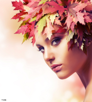 Woman with an intense stare wearing red leaves on her head