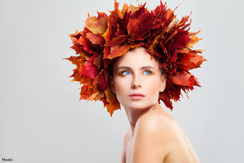 woman wearing a thanksgiving headdress with a white background